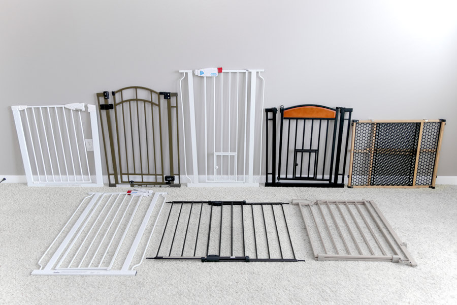 dog jumping over baby gate